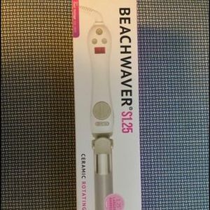 Brand new Beachwaver S1.25 dual voltage curling iron. Still in box, brand new!